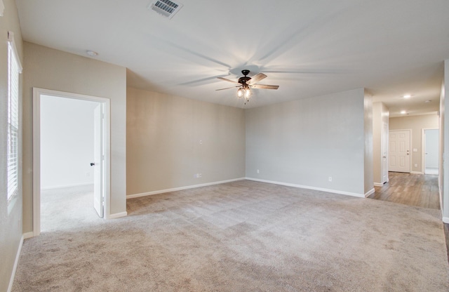 carpeted spare room with recessed lighting, visible vents, baseboards, and ceiling fan