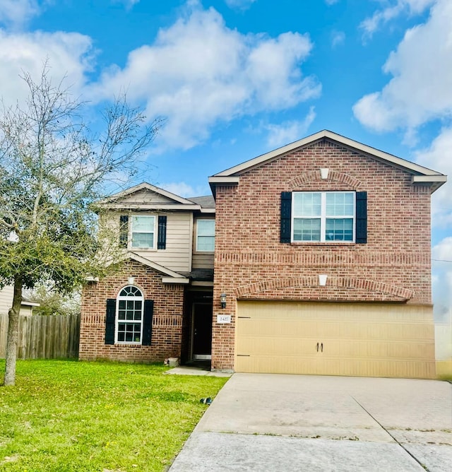 traditional-style home with a front lawn, fence, concrete driveway, a garage, and brick siding