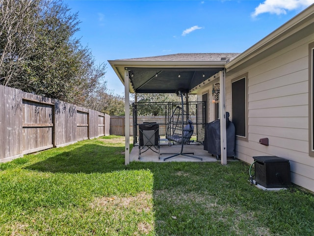 view of yard with a fenced backyard and a patio area