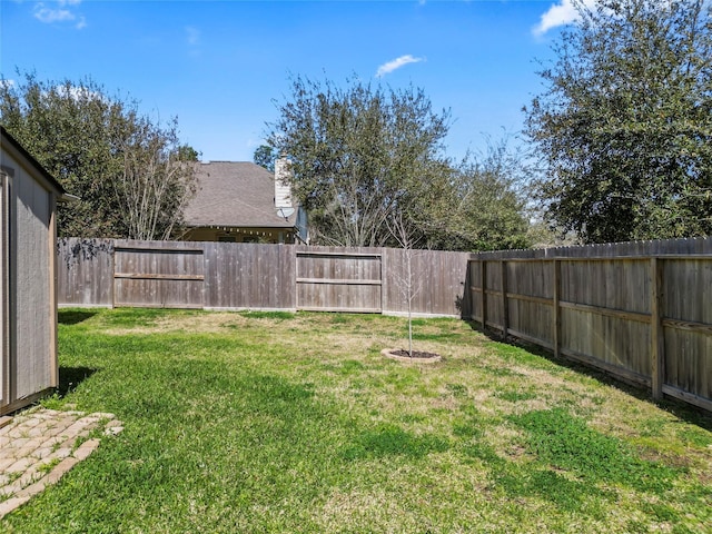 view of yard featuring a fenced backyard