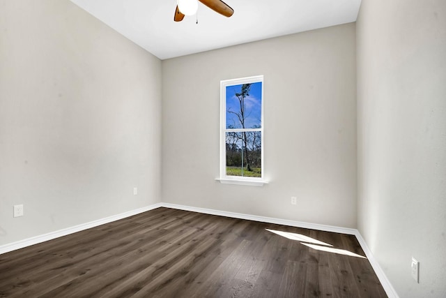 spare room with ceiling fan, baseboards, and wood finished floors