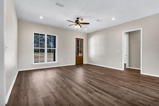 empty room with visible vents, baseboards, recessed lighting, dark wood-style floors, and a ceiling fan