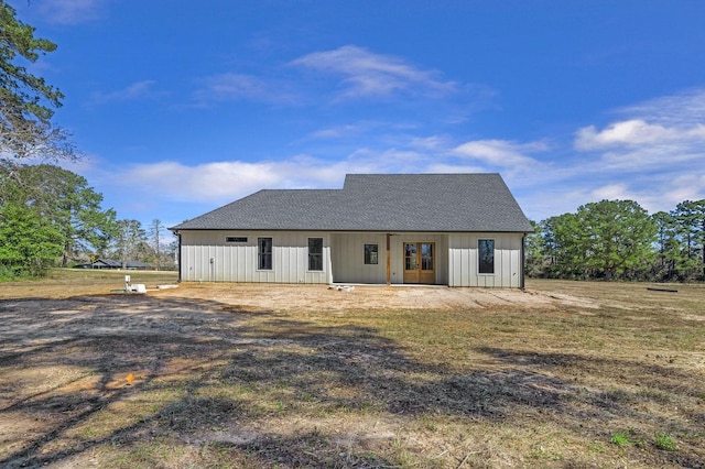 modern farmhouse style home with board and batten siding and a shingled roof