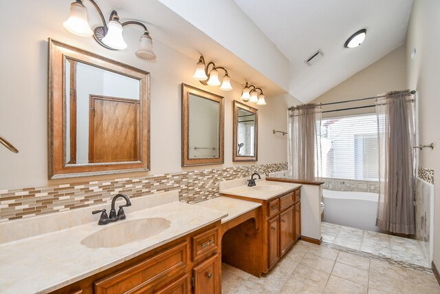 full bathroom featuring vaulted ceiling, visible vents, backsplash, and a sink