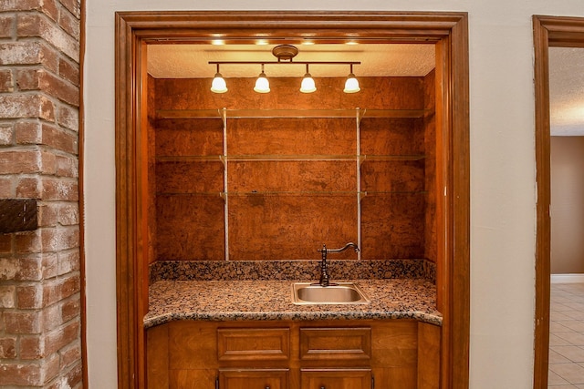 bathroom featuring tile patterned floors, a textured ceiling, and vanity