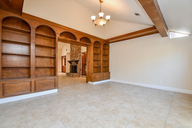 unfurnished living room featuring visible vents, built in features, a fireplace, baseboards, and vaulted ceiling with beams