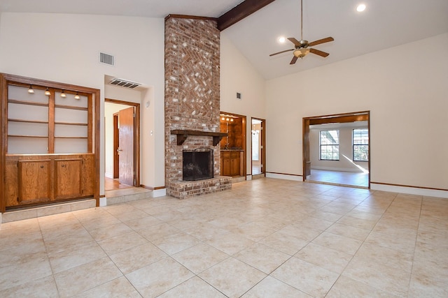 unfurnished living room featuring visible vents, beam ceiling, baseboards, and a fireplace