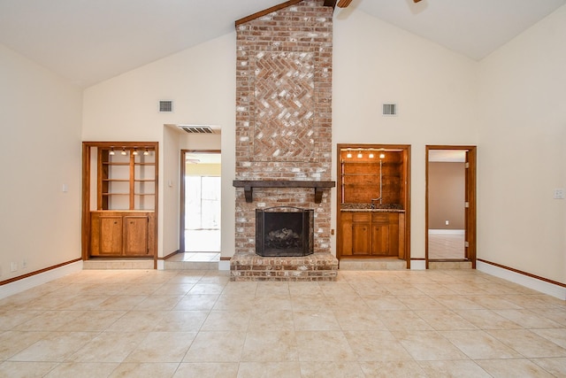 unfurnished living room with visible vents, a brick fireplace, and baseboards