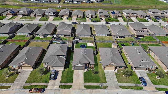 birds eye view of property with a residential view