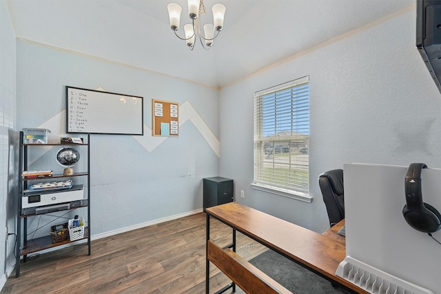 office with a notable chandelier, wood finished floors, baseboards, and a textured wall