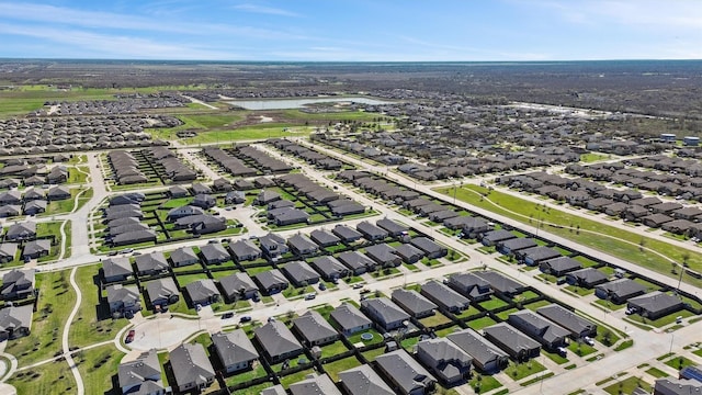 aerial view featuring a residential view and a water view