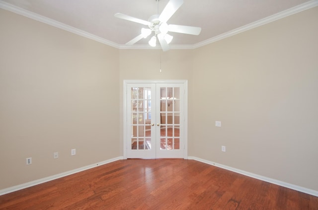 empty room featuring french doors, crown molding, baseboards, and wood finished floors