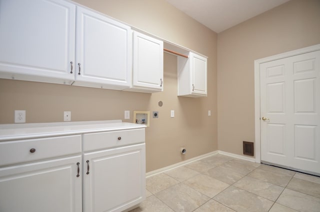 washroom featuring light tile patterned floors, baseboards, cabinet space, electric dryer hookup, and washer hookup