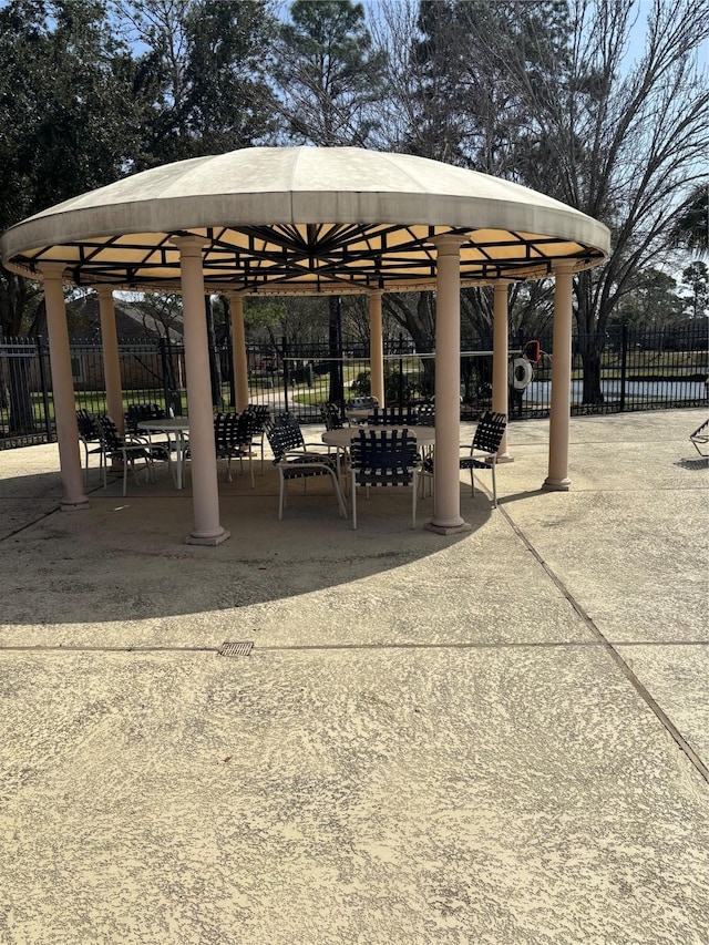 view of property's community featuring a gazebo and fence