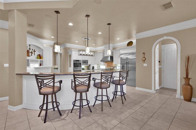 kitchen featuring visible vents, appliances with stainless steel finishes, a peninsula, white cabinetry, and open shelves