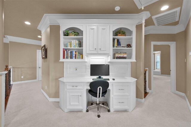 office space featuring visible vents, light carpet, baseboards, and crown molding