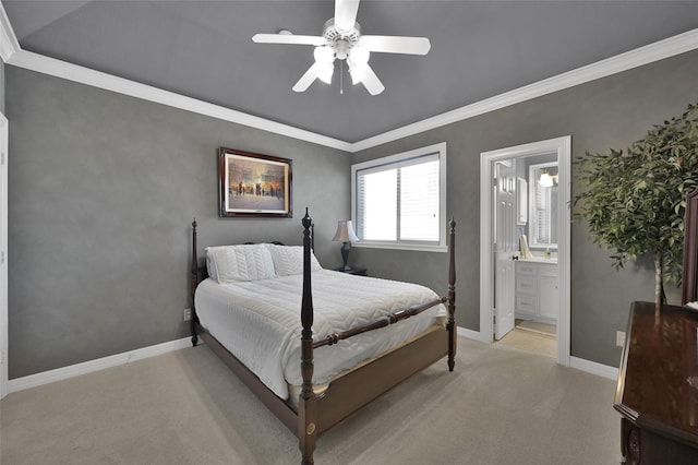 bedroom featuring a ceiling fan, baseboards, ornamental molding, ensuite bathroom, and light colored carpet