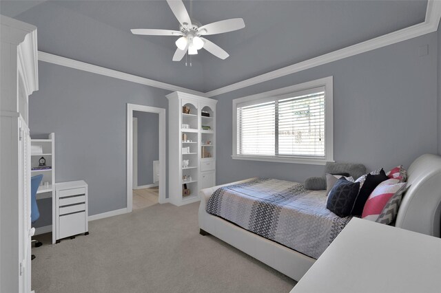 bedroom featuring light colored carpet, a ceiling fan, crown molding, and baseboards