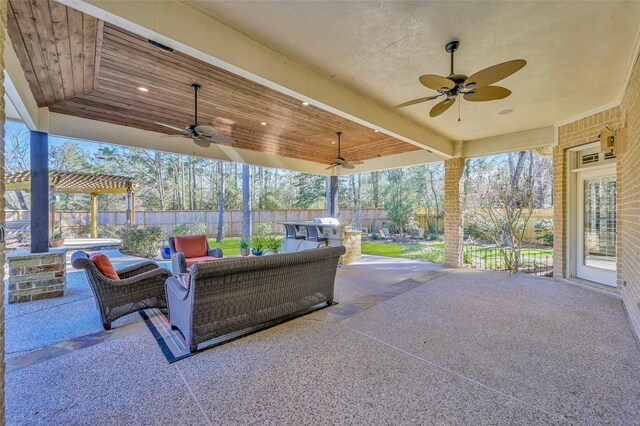 view of patio / terrace featuring an outdoor living space, a ceiling fan, and a fenced backyard