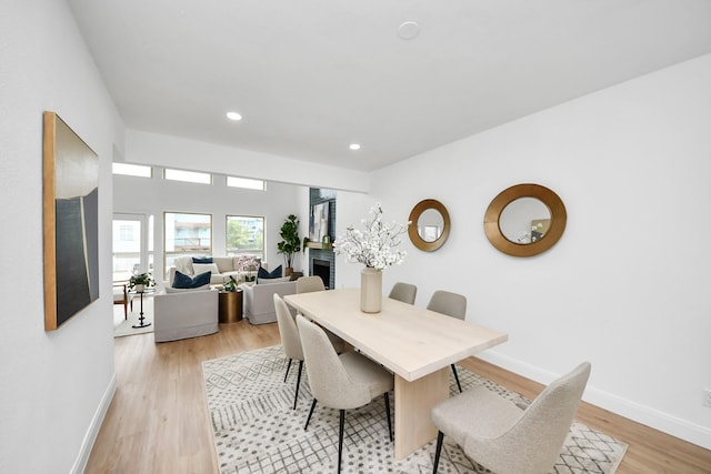 dining area featuring recessed lighting, baseboards, and light wood-style flooring