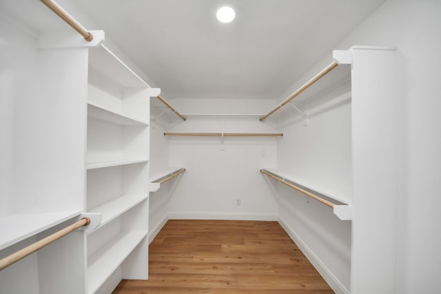 walk in closet featuring light wood-style flooring