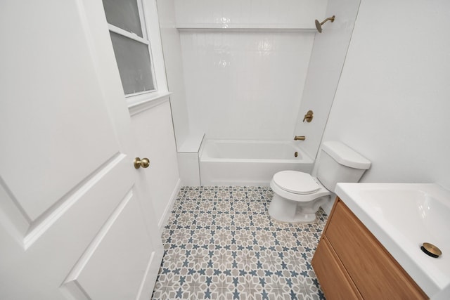 bathroom with tile patterned floors, bathing tub / shower combination, toilet, and vanity