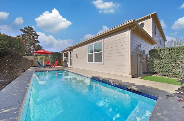 view of pool with a patio area, a fenced in pool, and a fenced backyard