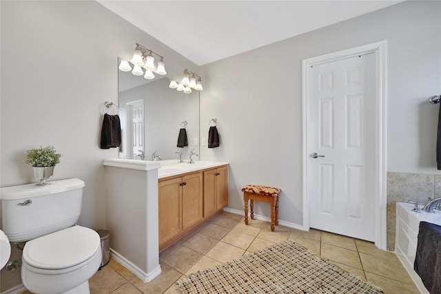 bathroom featuring a bath, baseboards, double vanity, tile patterned floors, and toilet