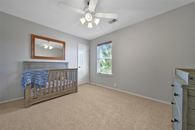 unfurnished bedroom with visible vents, baseboards, ceiling fan, and carpet flooring