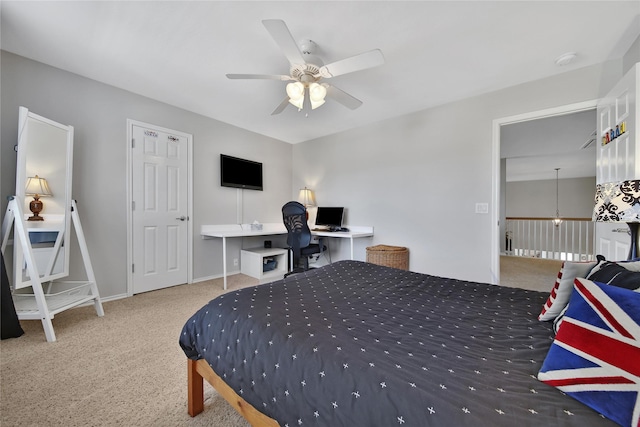 carpeted bedroom featuring baseboards and ceiling fan