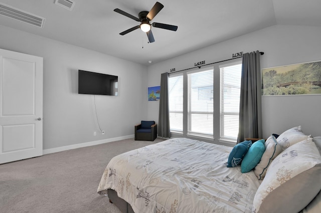 carpeted bedroom with visible vents, ceiling fan, baseboards, and vaulted ceiling