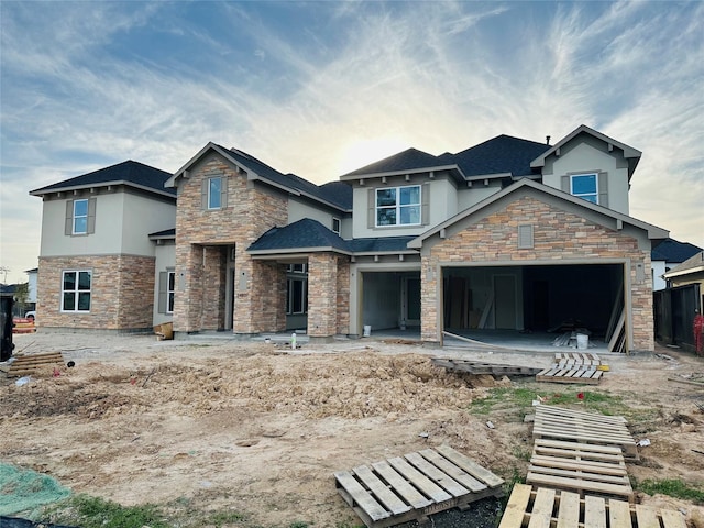 rear view of property featuring stone siding and stucco siding