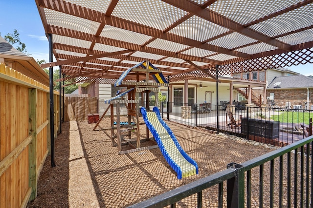 community playground with a fenced backyard