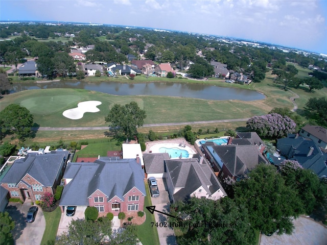 bird's eye view with a residential view, a water view, and view of golf course