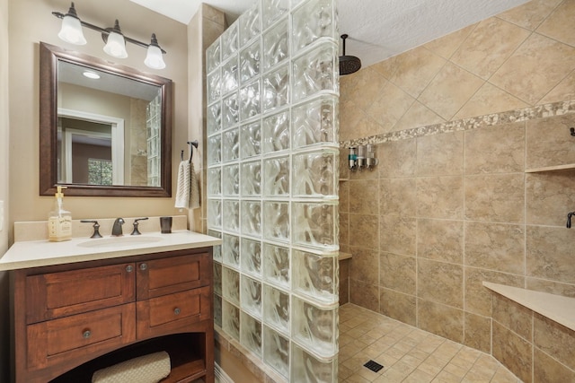 bathroom featuring vanity and a walk in shower