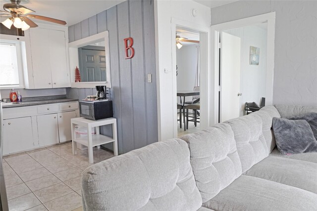 419 Murex St, Surfside Beach, TX 77541 - living room with light tile patterned floors and ceiling fan