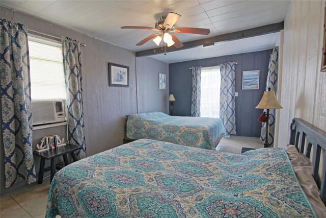 419 Murex St, Surfside Beach, TX 77541 - tiled bedroom with wooden walls, beamed ceiling, and ceiling fan
