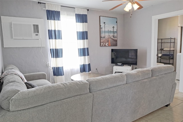 living room with light tile patterned floors, plenty of natural light, ceiling fan, and a wall unit AC