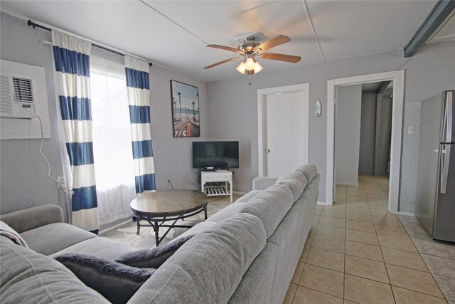 419 Murex St, Surfside Beach, TX 77541 - living area featuring light tile patterned floors, a wall mounted air conditioner, and ceiling fan