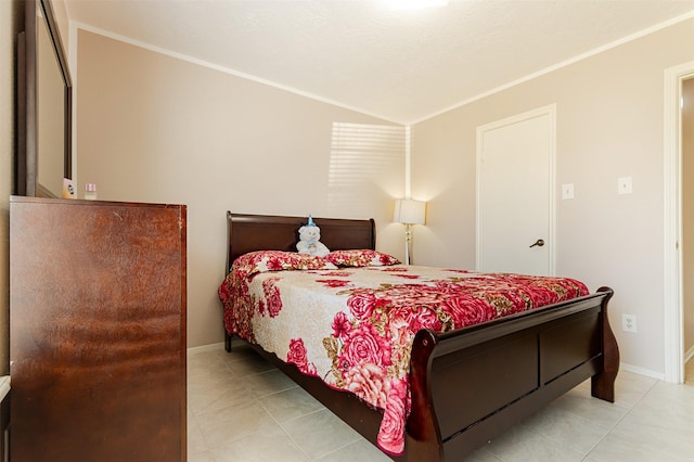 tiled bedroom featuring baseboards and lofted ceiling