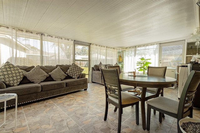 sunroom featuring wooden ceiling