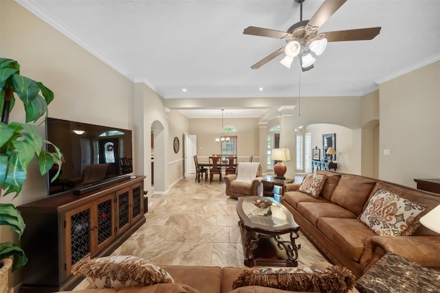 living room with ceiling fan, baseboards, arched walkways, and ornamental molding