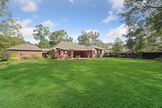 view of yard with a patio and fence