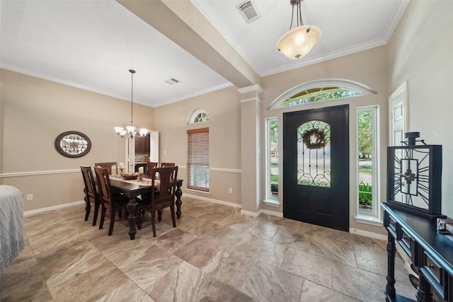 foyer entrance featuring visible vents, baseboards, a notable chandelier, and ornamental molding