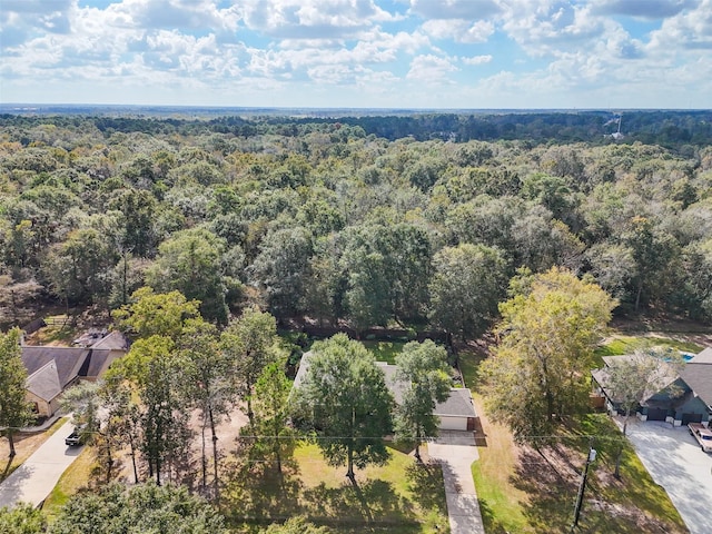 birds eye view of property with a wooded view