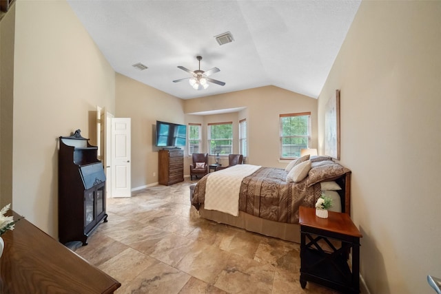 bedroom featuring visible vents, baseboards, lofted ceiling, and a ceiling fan