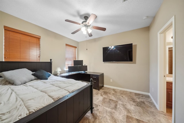 bedroom with a ceiling fan, baseboards, and a textured ceiling