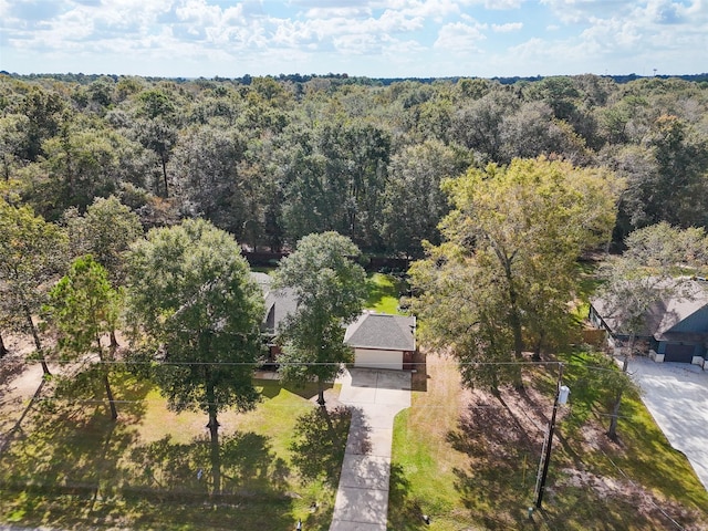 aerial view featuring a wooded view