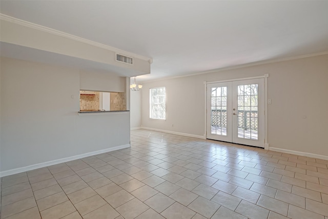 spare room featuring visible vents, french doors, baseboards, and ornamental molding