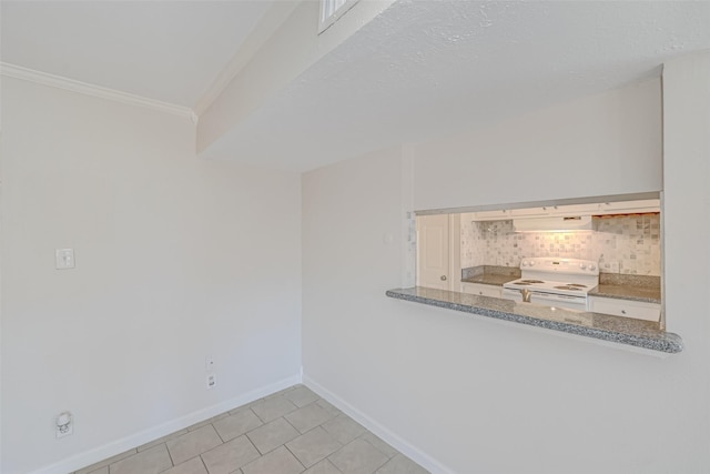 spare room with crown molding, light tile patterned floors, and baseboards